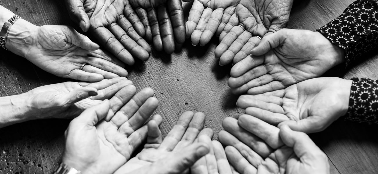 Hands of many ages, races, etc. in a circle